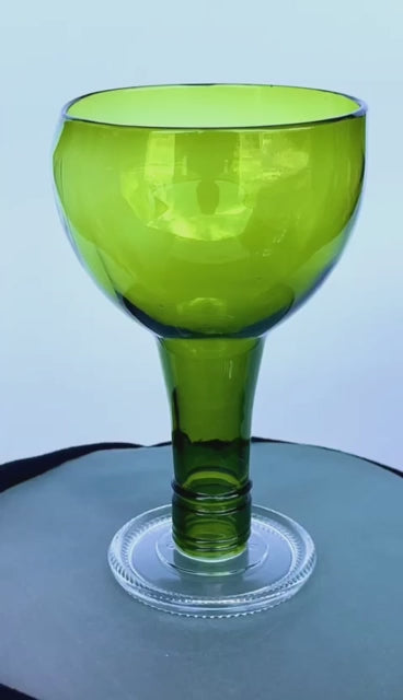 Our shinning green wine glasses are all hand made from repurposed wine bottles collected from our local community. They are an amazing addition to your event tableware.